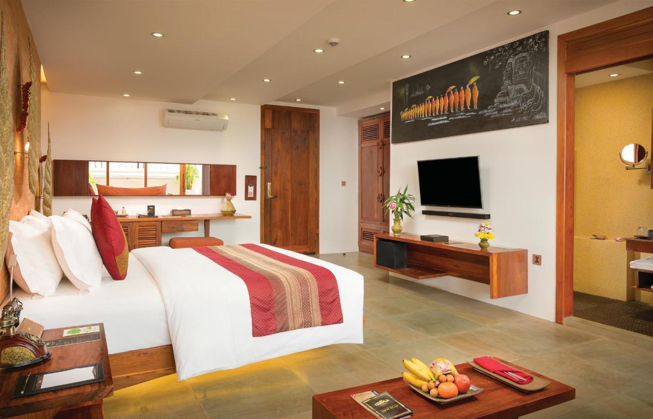 Golden Temple Residence Siem Reap Exterior foto A bedroom at the resort