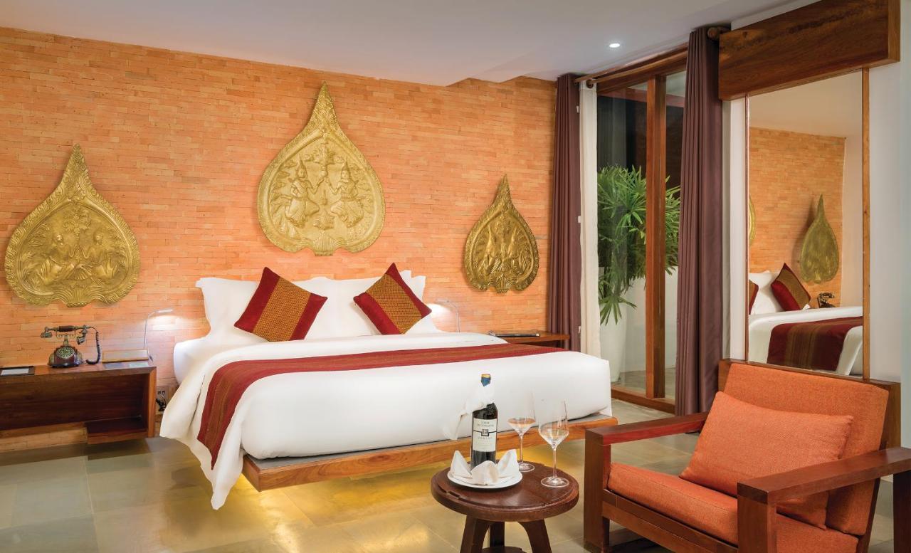 Golden Temple Residence Siem Reap Exterior foto A bedroom at the hotel